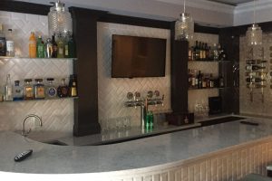 Custom Glass Bar Shelves and Memorabilia Showcase at North Caldwell, NJ Home