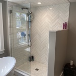 Hinged shower splash panel