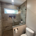 Knee wall shower splash panel
