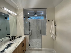 Frameless Shower Enclosure and Vanity Mirror in Denville, NJ.