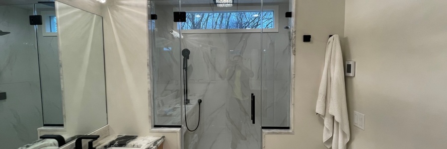 Frameless Shower Enclosure and Vanity Mirror in Denville, NJ.