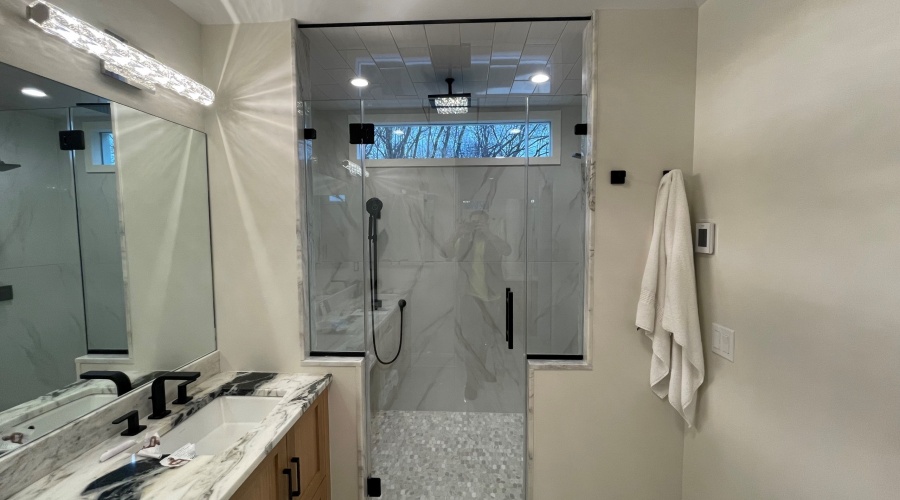 Frameless Shower Enclosure and Vanity Mirror in Denville, NJ.